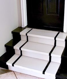 black and white steps leading up to a door