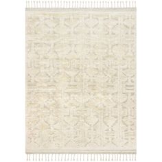 a white rug with fringes on the bottom and an area rug in the middle