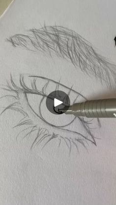 someone is drawing an eye with a pencil