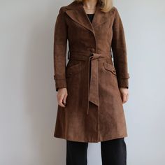 Vintage dark chocolate brown suede coat. Great vintage condition. Made in Ireland by Julian Yard in 90's. Fully lined, two pockets plus belt. Outer shell 100% suede. Originally women's size S depending on desire fit but please check measurements carefully. Classic.  Armpit to armpit laying flat 43cm=17' Sleeve from armpit 42cm=16'5 Waist 76cm=30' Total length 101cm=39'5 Model is 164xm=5'4 tall UK size 10. Long Leather Jacket, Suede Fashion, Suede Coat, Brown Jacket, Short Trip, Dark Brown Leather, Nice Leather, Brown Suede, Chocolate Brown