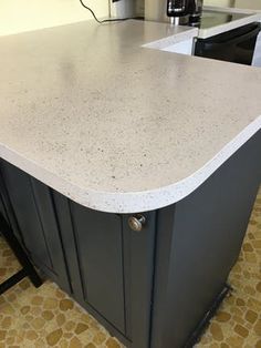 a kitchen counter top with an oven in the background