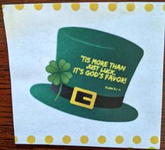 a st patrick's day card with a green hat