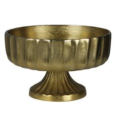 a golden metal bowl on a white background