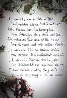 a poem written in german on a sheet of paper with flowers and leaves around it