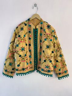 "Woman's jacket cotton Designer embroidery. This jacket was hand-made with vintage style phulkari embroidery by artisans from the nomadic desert tribe known as \"Banjara \", in the Northern India. The Jacket is no closure pattern with Long Sleeves and Vibrant Color  Size : Stitching available in all sizes you want Please Send all your measurements after placing order  Length 23 Inches Sleeve Length 23 Inches Chest - 40 Inches Shipping : Free worldwide shipping. (Note : Design of Embroidery May be change) Assorted Designs Available Condition: New Delivery Policies: . We dispatch your item within 1-3 days after order receive. . After dispatching item nothing in our hand like Exact delivery time. . You are responsible for the duties and taxes of your country. Return Policies: . Shipping charg Traditional Nehru Jacket With Dabka Work For Spring, Traditional Outerwear With Dabka Work, Festive Outerwear With Chikankari Embroidery, Traditional Outerwear With Resham Embroidery For Spring, Traditional Outerwear With Resham Embroidery For Fall, Festive Chikankari Embroidery Long Sleeve Outerwear, Traditional Long Sleeve Outerwear With Dabka Work, Traditional Outerwear With Resham Embroidery And Long Sleeves, Traditional Resham Embroidered Outerwear For Fall