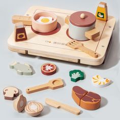 an assortment of wooden toys sitting on top of a table