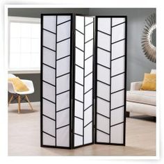 the room divider is decorated with black and white panels