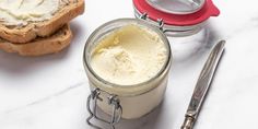 a jar of ice cream next to some bread