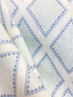 the fabric is blue and white with dots on it