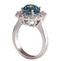 Stamped: 14K White GoldTotal Ring Weight: 6.5 GramsRing Length: N/ARing Width: N/AGemstone Weight: Total Natural Zircon Weight is 4.43 Carat (Measures: 8.21x8.23 mm)Color: BlueDiamond Weight: Total Natural Diamond Weight is 0.90 CaratColor: F-G, Clarity: VS2-SI1Face Measures: 13.42x13.67 mmSku: [702649W] Formal Emerald Ring With Halo And Round Cut, Formal Emerald Ring With Halo, Formal Emerald Halo Ring With Round Cut, Luxury Birthstone Ring With Round Cut Center Stone, Exquisite Topaz Ring With Center Stone For Anniversary, Formal Round Emerald Ring With Halo, Luxury Halo Topaz Ring, Luxury Ring With Halo Design And Round Stone, Luxury Platinum Topaz Ring With Halo Setting