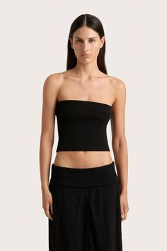 A strapless, ribbed knit top. Fitted around the bodice, it crops just above the waist and features a diagonal fold-over detail around the neckline. Style with the Ciele Maxi Skirt for transeasonal occasionwear or late night affairs. Chic Seamless Elastane Tube Top, Strapless Elastane Tube Top For Night Out, Chic Fitted Bandeau Off-shoulder Top, Chic Bandeau Tube Top In Elastane, Chic Bandeau Tube Top, Fitted Strapless Off-shoulder Top For Evening, Chic Seamless Tube Top For Night Out, Chic Fitted Seamless Tube Top, Chic One Shoulder Bandeau Top