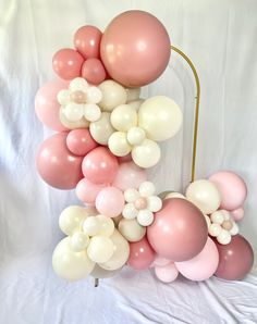 a bunch of balloons that are on a stand