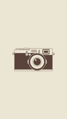 an old photo camera on a beige background