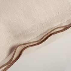 a close up view of the zipper on a pillow