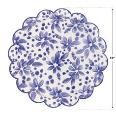 a blue and white flowered plate with measurements for the center piece on top of it