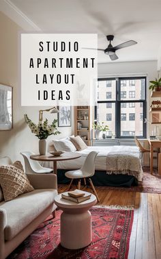 a living room filled with furniture next to a bed and a desk in front of a window