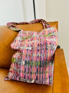 Beautiful handwoven tote bag made from "Tela de Corte"This multi purpose bag can be used as a tote, for shopping, travel, laptop carrier, or beach bag.Each piece is handmade featuring a unique design.As a unique handmade product each product may vary.No two are exactly the same and imperfections are to be expected and appreciated.What is Tela de Corte?Cortes are long pieces of treadle loom woven fabric that are used to make women's skirts. MEASUREMENTSLength: 15 inches Width: 14 inchesHandle length: 11 inches(approximately)As a handmade product size may slightly vary. MATERIAL & CARECottonWe recommend hand wash only with cold water.Do not bleachHang to dry Casual Multicolor Straw Tote Bag, Casual Multicolor Hobo Tote Bag, Casual Multicolor Square Straw Bag, Casual Multicolor Woven Shoulder Bag, Multicolor Rectangular Hobo Bag For Vacation, Multicolor Hobo Tote Bag For Beach, Casual Handwoven Beach Bag For Everyday Use, Casual Everyday Handwoven Beach Bag, Casual Multicolor Rectangular Hobo Bag