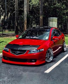 a red car parked in a parking lot