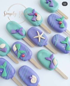 there are some little mermaid cakes on the sticks