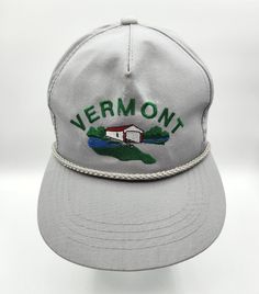 This vintage Vermont hat is a unique find for any hat enthusiast. The Yupoong embroidered bridge rope trucker hat features a gray color and adjustable sizing. The hat is unbranded and has a solid pattern, making it versatile for any occasion. The hat's theme includes nods to Maine, fishing, lakes, and the 90s. Its vintage style brings a touch of nostalgia to any outfit. Perfect for men of all ages, this hat is a great addition to any collection. Maine Fishing, The 90s, Brands Outlet, Solid Pattern, Vermont, Pattern Making, Trucker Hat, Vintage Style, Maine