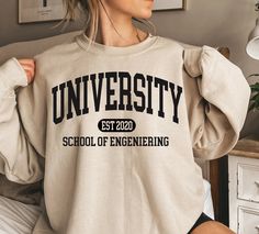 🎅LAST DAYS FOR CHRISTMAS DELIVERY.🎅 USA →  12/12/2023  CANADA → 12/12/2023 EUROPE →  12/12/2023 Custom College Sweatshirt, Personalized College Sweater, Customized School Sweatshirt, Custom Pullover, University Hoodie, College Program Each sweater is printed on order with love ❤ This sweater essential fits like a well-loved favorite. The excellent quality print makes one to fall in love with it over and over again. Size chart available in photo. Any questions? Just ask :) Want to personalise something? Just drop me a line... Halloweentown Movie, Halloween Town Movie, Silly Goose University, Halloweentown University, College Sweater, School Sweatshirts, University Shirt, Silly Goose, Cute Shirt Designs