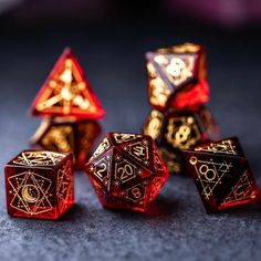 four red and gold dices sitting next to each other