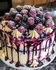 a cake with berries and blueberries on top