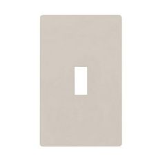 a white light switch plate on a white background, with the cover facing up to the right