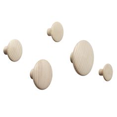 three wooden knobs are shown on a white background