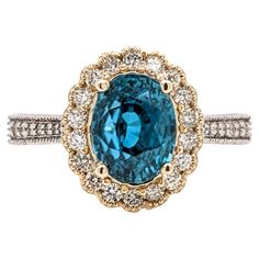 This elegant ring features a 4.15ct gorgeous sparkling Blue Zircon in 14K solid gold with natural earth mined diamonds and milgrain detail. This collection ring makes for a stunning accessory to any look! A fancy ring design perfect for an eye catching engagement or anniversary. This ring also makes a beautiful December birthstone gift for your loved ones! Specifications: Item Type: Ring Centre Stone: Blue Zircon Treatment: Heated Weight: 4.15 ct Head size: 9x7mm Shape: Oval Hardness: 7.5 Metal: 14k/4.89g Diamond Clarity/Color: SI / G-H Diamond Count/Weight: 34/0.43 cttw SKU: AJR213/2335/3319 This ring is made with solid 14K Gold and natural Earth mined SI / G-H diamonds. As listed, this ring is ready to ship. If you're interested in purchasing this setting with a different center stone pl Vera Wang Engagement Rings, Blue Zircon Ring, White Engagement Ring, Contemporary Engagement Rings, Yellow Engagement Rings, Fancy Rings, Modern Engagement Rings, Dream Beach, Engagement Rings Platinum