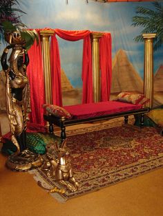 an elaborately decorated room with red drapes