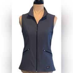 Kerrits Equestrian Grey Soft Sleeveless Shell Gray Riding Vests Zipper Pockets Zipper Front Closure 80% Nylon 10% Spandex Light Weight Gray Color Riding Vests Machine Wash Cold Tumble Dry 16.5 Armpit To Armpit 23 Inches Shoulder To Hem Size S Nwt Functional Fitted Vest For Fall, Functional Fitted Fall Vest, Fitted Sporty Vest For Fall, Sporty Fitted Vest For Fall, Fitted Vest For Outdoor Activities, Sporty Fitted Vest For Outdoor, Fleece Vest Women, Riding Vest, Horse Riding Equestrian