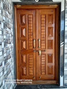 a wooden door is open in front of a wall with decorative tiles on the walls