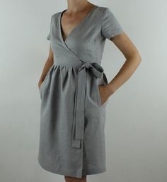 "Spring dress, Write the selected color in the message Handmade sand wrap dress with short sleeves, 2 pockets and belt , perfect for casual wear and suitable for any occasion in any season Details: - 100% natural linen produced in Europe ; - medium weight (180 gram per square meter); - color: light grey, could be any from our colors alog cat(color samples at the photo); Made to order, approximately a few days, If you have any questions please message me and I will be glad to answer. Size guide : Elegant V-neck Linen Dress With Pockets, Elegant Short Sleeve Linen Dress With Belt, Beige Summer Wrap Dress, Short Sleeve Tie Waist Wrap Dress For Day Out, Beige Short Sleeve Wrap Dress, Elegant Summer Linen Dress With Surplice Neckline, Gray Linen Short Sleeve Dress, Gray Short Sleeve Linen Dress, Short Sleeve Linen Dress With Tie Waist For Work