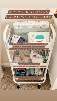 a white cart filled with lots of diapers and other items on top of a carpeted floor