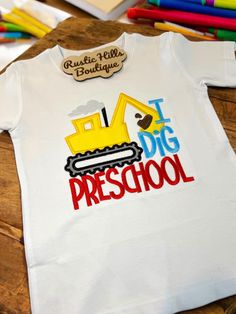 Welcome to our Etsy shop!  This shirt is perfect for the little guy in your life starting school. The embroidery on it is beautiful! The backing I use on children's apparel is thicker and softer than what I use on adult shirts- to provide extra comfort for the kiddos. You can choose to personalize the shirt with a name, it will be added to the dozer in red thread.  Once we hand your package off to UPS or USPS, we are not responsible for lost nor stolen packages. We will help with what we can, but are not responsible after it's out of our hands.  Shirt is 100% cotton.  Shirt color: white  Shirt size options: 3T & 5T Our socials: RusticHillsBoutique on: Instagram TikTok Facebook page.  Rustic Hills Boutique Insiders for our Facebook group. Embroidered Short Sleeve Top For School, Embroidered Short Sleeve School Top, White Embroidered T-shirt For School, Cotton Tops For School Spirit Playtime, Kindergarten Orange Shirt Day, School Spirit T-shirt With Embroidered Graphics, First Day Of School Shirts For Boys, Cotton T-shirt For End Of School Year Playtime, End Of School Year Playtime Cotton T-shirt