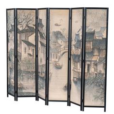 This freestanding 6-panel room divider adds a sense of tranquility (and a little bit of privacy) to larger spaces. The woven bamboo surface of all six panels depicts a classic print of a small canal town using traditional black and blue inks, with house rooftops that call to mind ancient villages in eastern Asia. A solid pine wood frame brings extra durability - and each panel is connected by hinges, so it's easy to fold up when you want to tuck it away. It measures a bit under 6' tall and stret Privacy Partition, Black Ink Art, Folding Room Divider, Work Cubicle, Bamboo Room Divider, Wooden Room Dividers, Bamboo Panels, Folding Room Dividers, Asian Architecture