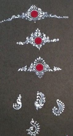 some white and red designs on a black surface