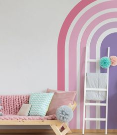 a child's room with pink and purple walls