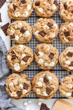 chocolate chip cookies with marshmallows and graham crackers on a cooling rack