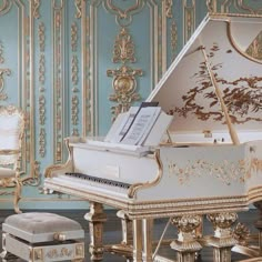 a grand piano sitting on top of a hard wood floor