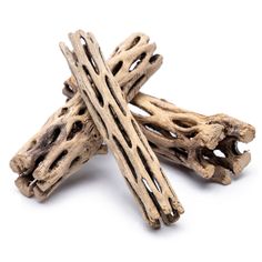 three pieces of driftwood on a white background