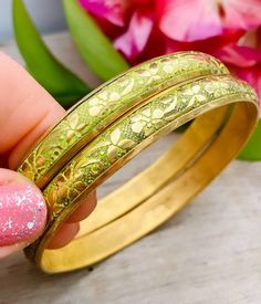 Vintage green enamel/ painted flower pattern two bangle bracelet. the bangles measuring 5/16 inches wide by 2 3/4 inches in diameter. The bangles are vintage so it has age wear and the brass has age spots and all. The floral design is beautiful and in good vintage condition, please view pictures for details and conditions. Cheap Vintage Beaded Bangle Bracelets, Affordable Vintage Party Bangle, Painted Flower Pattern, The Bangles, Painted Flower, Enamel Paint, Mid Century Vintage, Age Spots, Green Enamel