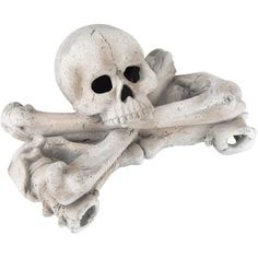 a white skull and crossbone statue on a white background