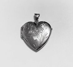 High-end engraved heart locket pendant:metal       : solid 18k yellow gold/solid white goldweight    = 8.9 grlength     = 1.25"inch ( 30mm) including the bailwigth      = 1"inch       ( 24mm)made      : in Italybail size  = 5mm x 7mmwe offer free worldwide shipping Formal Engraved Heart Pendant Locket Necklace, Engraved Double Heart Locket Necklace In White Gold, Engraved Locket Necklace For Valentine's Day Formal Occasions, Engraved White Gold Heart Pendant Locket Necklace, Engraved White Gold Heart Locket Necklace, Classic Heart-shaped Engraved Locket Necklace, Heart-shaped Engraved Locket Necklace Gift, Elegant Heart-shaped Yellow Gold Locket Necklace, Heart-shaped Yellow Gold Locket Necklace