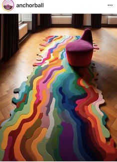 the colorful rug is on the floor in front of a window with curtains and windowsills