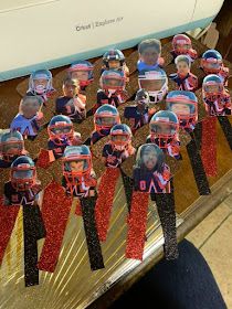 a group of little kids wearing helmets and standing in front of a sewing machine with sequins on them