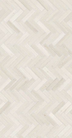 an image of white wood flooring that looks like herringbones or chevron