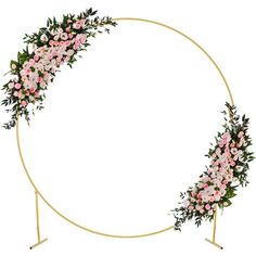 a circular gold frame with pink flowers and greenery