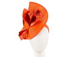 Large orange twisted plate decorated with silk abaca bow. Hand made in Melbourne by our skillful milliners, this headpiece will be a crown jewel of your spring racing outfit.  Made in Australia  Exclusive materials  Stylish design by Fillies Collection  Comfortable headband Summer Formal Fascinator With Ribbon, Elegant Orange Fascinator For Races, Elegant Orange Fascinator For Royal Ascot, Summer Evening Orange Fascinator, Orange Summer Headband Fascinator, Orange Fitted Headpiece For Kentucky Derby, Elegant Orange Fascinator For Formal Occasions, Elegant Orange Fascinator For Formal Events, Orange Spring Evening Fascinator